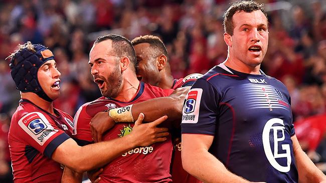 Jono Lance celebrates scoring for the Reds on Friday night.