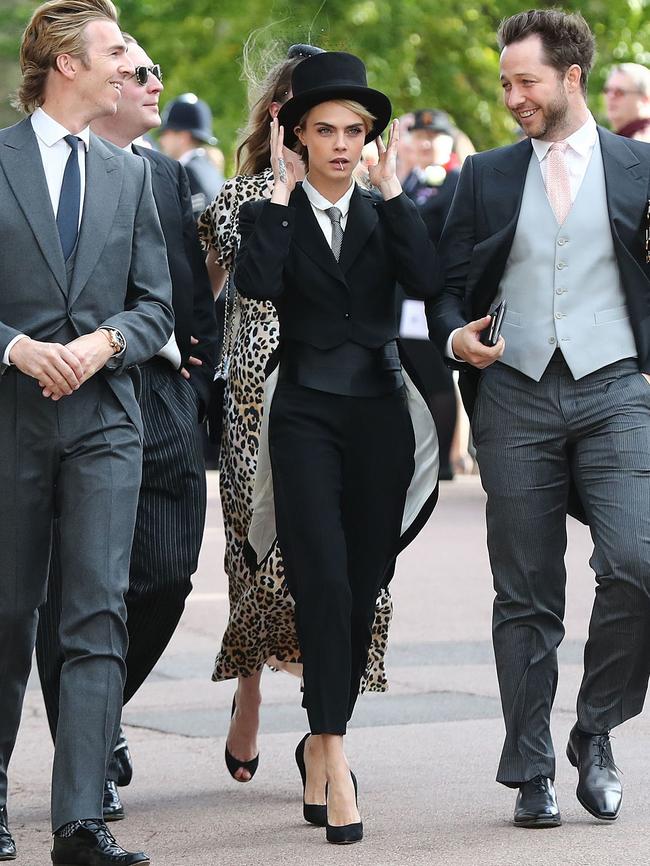 Cara Delevingne making a real statement in suit and top hat. Picture: AFP