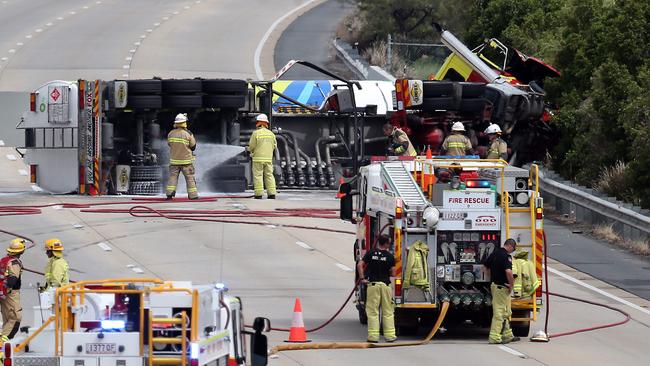 The petrol tanker rollover shut down the M1 in both directions at Helensvale. Picture: AAP Image/Richard Gosling