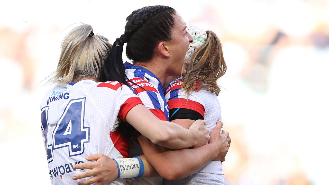 Romy Teitzel celebrates her try with Knights teammates. Picture: Getty