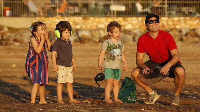 Aaron McMahon (R) with daughter Eve, 5, son Jacob and nephew Lenny Caffrey, both 3, prepare for the fireworks show at Mindil Beach to celebrate Territory Day. Pic Glenn Campbell