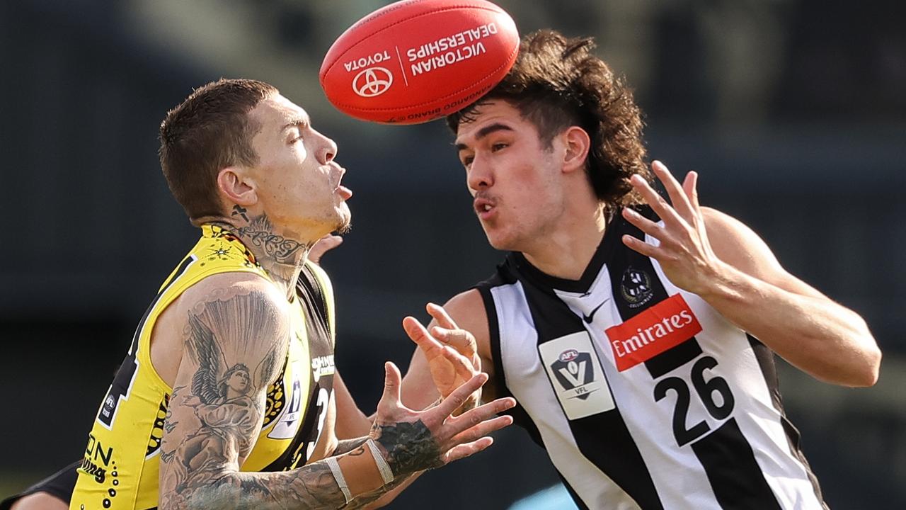 Young Magpie Reef McInnes competes with Richmond’s Matt Parker during a round 13 VFL match at Punt Rd on July 11, 2021.