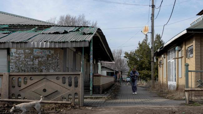 A woman walks near a damaged building in Kostyantynivka, Donetsk region, this week. Picture: Tetiana Dzhafarova / AFP