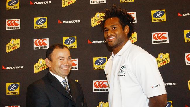 Wallaby back Lote Tuqiri shares a joke with team coach Eddie Jones. (AAP Image/Julian Smith)