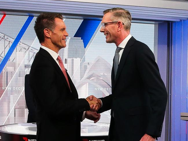 SYDNEY, AUSTRALIA - Newswire Photos MARCH 08 2023 - NSW Labor leader Chris Minns and NSW Premier Dominic Perrottet are seen shaking hands after they went head to head in a televised debate at Channel 7 Studios in Sydney ahead of the 2023 NSW State Elections. Picture: NCA Newswire / Gaye Gerard