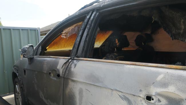 A car was destroyed and a family was forced to flee their burning home.