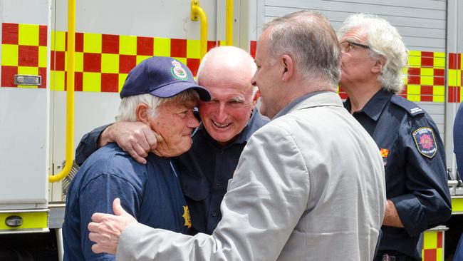 Federal opposition leader Anthony Albanese visits Cudlee Creek CFS following devastating bushfires in the area, Saturday, November 4, 2020. Fulltime volunteer firefighter Mike Larecki, left, who has been deployed to Queensland, NSW and Vic this season, broke down when talking about his experiences to Albo and Cudlee Creek CFS Captain Mark Hawkins. Photo: Brenton Edwards.