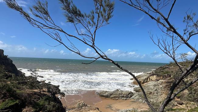 Multiple people said the pair were swimming off the coast of Round Hill Head, directly east of the 1770 camping ground, when the tragedy unfolded about 2pm.