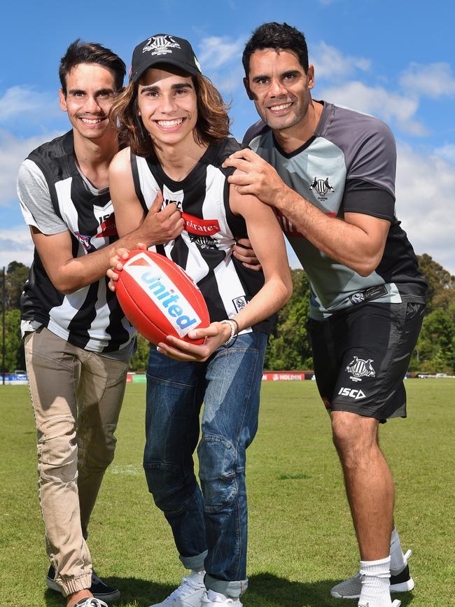 X-Factor winner Isaiah (centre) with his Jamarrah Firebrace new Magpie Daniel Wells. Picture: Tony Gough