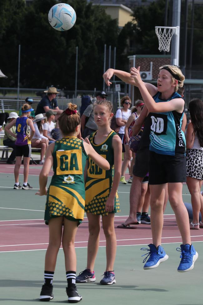 The Netball Qld Primary Schools Cup grand finals are being held at the Hinterland District Netball Association at Mudgeeraba. Homies (home schooled kids) player Peter White in action against Gilston's Taylor Collis. Picture: Mike Batterham.
