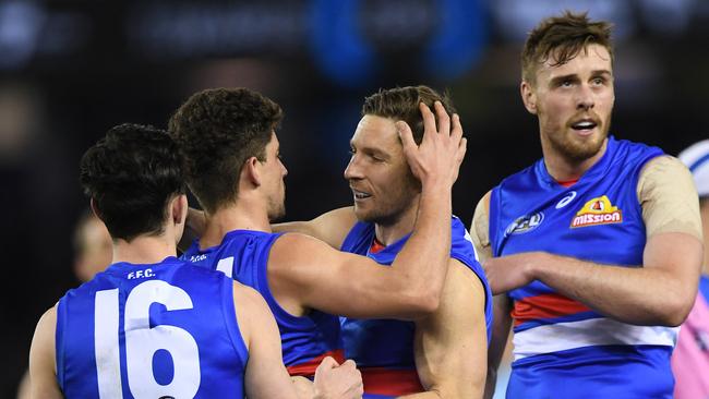 Players embrace Matthew Boyd after a goal. Picture: AAP Images