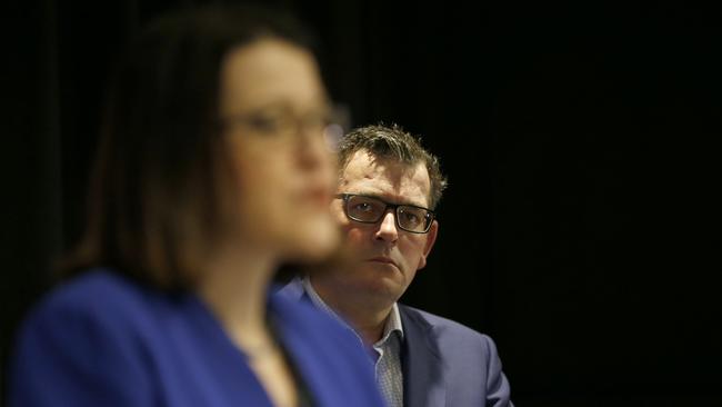 Victorian Premier Daniel Andrews looks on as Health Minister Jenny Mikakos speaks to the media on Friday. Picture: Darrian Traynor/Getty Images