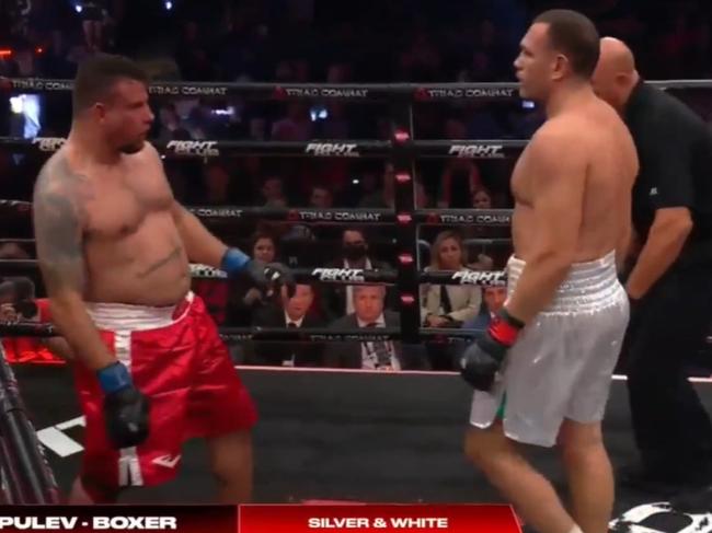 Frank Mir wobbles on his feet as Kubrat Pulev waits for the ref to step in.