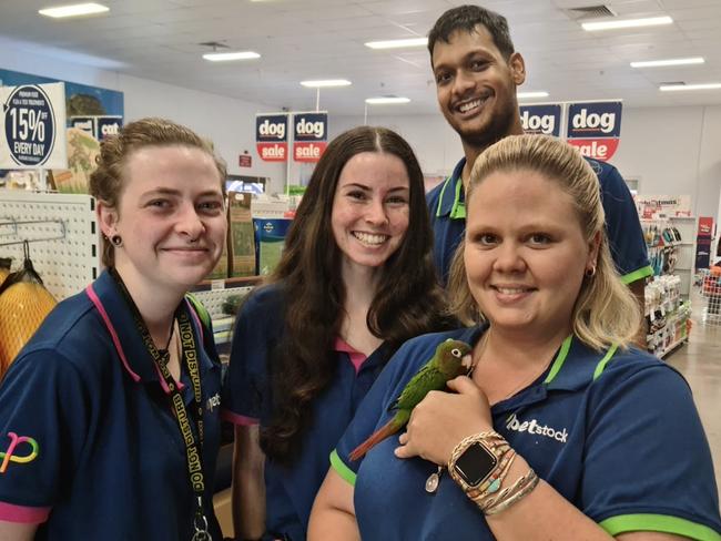 The Petstock Darwin team celebrates the return of a rose crowned conure.