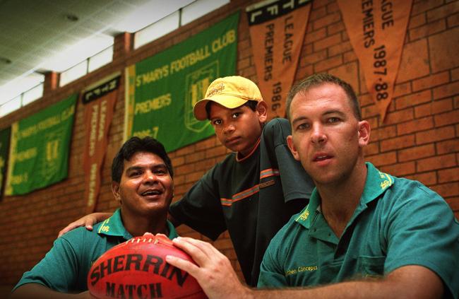 St Marys stalwart Cyril ‘Junior’ Rioli in 2007 before his 250th game for St Marys in the NTFL with his son and former Hawthorn star Cyril ‘Junior Boy’ Rioli. Picture: Susan Brown