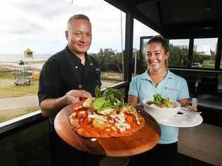 FINE FOOD: North Kirra Surf Life Saving Club head Chef Bernie Powling and staff member Brianna Buvnett. Picture: Scott Powick