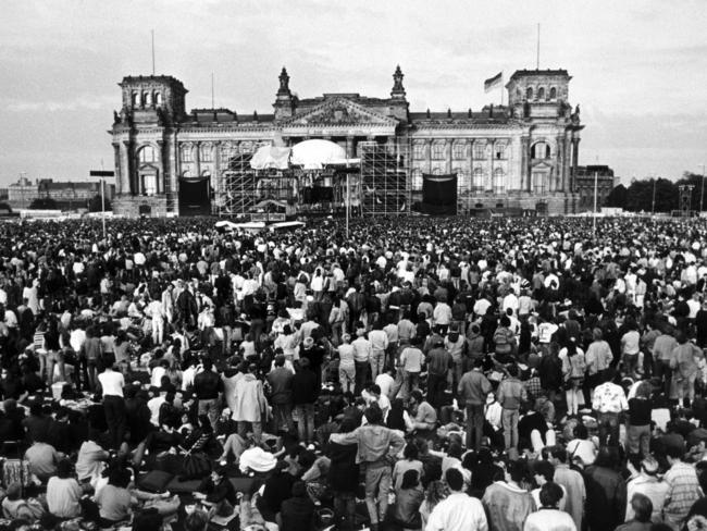 1987 ... people gathering in front of the Reichstag building in then West Berlin to attend a concert of British musician David Bowie. Picture: AFP