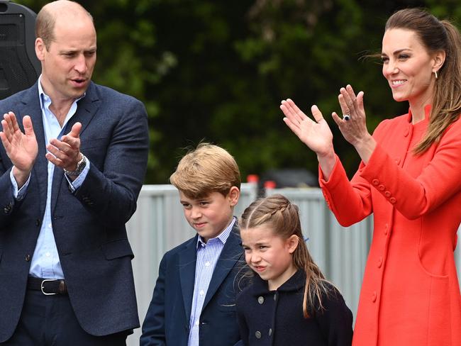 Prince William, Duke of Cambridge, Catherine, Duchess of Cambridge, and their children Prince George and Britain's Princess Charlotte applaud a rehearsal. Picture: AFP