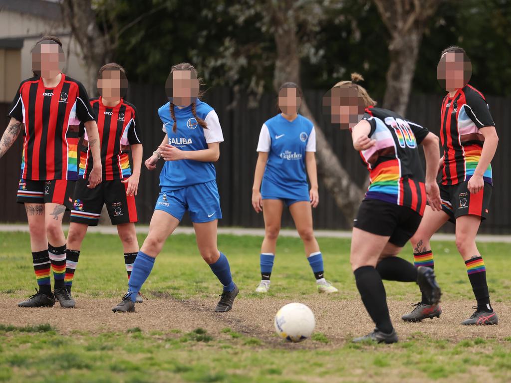 Flying Bats FC (red and black stripes) playing Normanhurst Eagles (blue and white) at Morrison Bay Park in Putney.