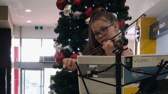 Matilda Saunders, 10, raised more than $2000 for the Sydney Children's Hospital playing the violin at St Clair Shopping Centre. Pic: Supplied.