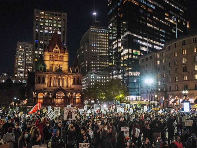 People gather at Copley Square at the Boston Public Library calling for a new political party and system. Picture: AFP