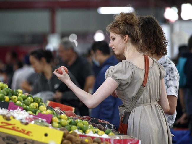 Shoppers at Queen Victoria Market enjoy easing of restrictions of mandatory mask wearing. Picture: NCA NewsWire / David Geraghty