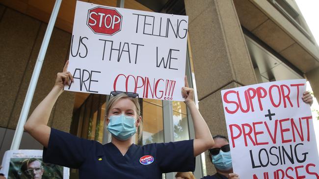 Nurses from across Sydney gathered in front of NSW Parliament today to protest staff shortages and wages. Picture: NCA NewsWire / David Swift