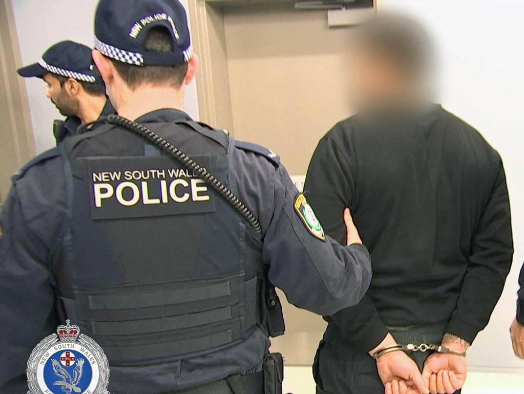 Marko Krivosic is taken to Liverpool police station after being arrested in Perth. Source: NSW Police Force.