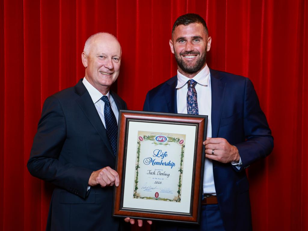 AFL Commission chair Richard Goyder (left) presents Jack Darling with his AFL life membership in March after more than 300 home and away and pre-season matches for West Coast. Picture: Hanna Lassen