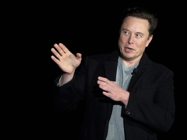 Elon Musk gestures as he speaks during a press conference at SpaceX's Starbase facility near Boca Chica Village in South Texas on February 10, 2022. - Billionaire entrepreneur Elon Musk delivered an eagerly-awaited update on SpaceX's Starship, a prototype rocket the company is developing for crewed interplanetary exploration. (Photo by JIM WATSON / AFP)