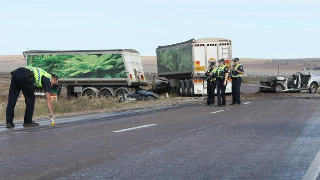 Police, Major Crash Investigators and CFS survey the scene of the head-on crash on the Yorke Hwy near Port Arthur. Picture: Emma Brasier.