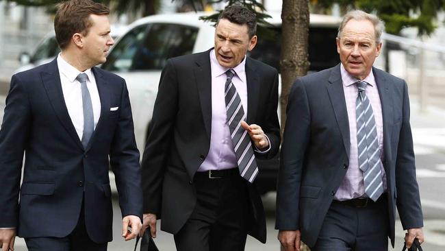 Danny Corcoran attending an AFL Commission hearing with his lawyers in 2013. Picture: Michael Klein