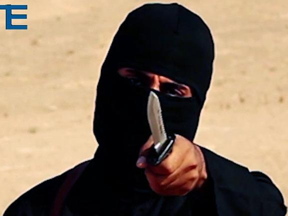 UPLOADED IMAGE - FILE - This image made from militant video, which has been verified by SITE Intelligence Group and is consistent with other AP reporting, shows Mohammed Emwazi, known as "Jihadi John,” who appeared in several videos depicting the beheadings of Western hostages. SITE, which tracks terrorist activity, says the Islamic State group is acknowledging the death of the masked militant and published a "eulogizing profile" of him on Tuesday, Jan. 19, 2016, in its English-language magazine Dabiq. (SITE Intelligence Group via AP)