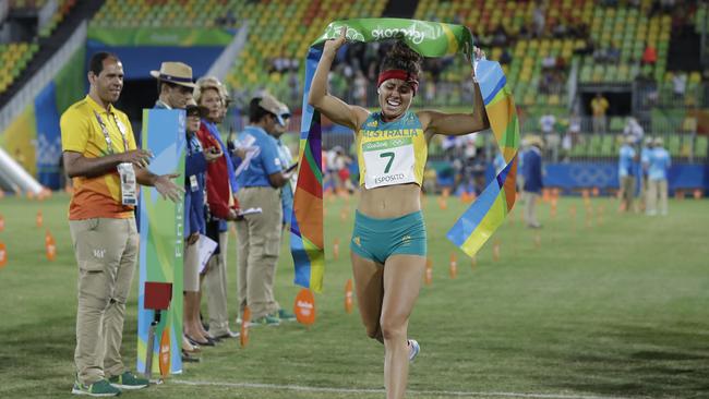 Chloe Esposito crosses the finish line to win the gold medal in the women's modern pentathlon.