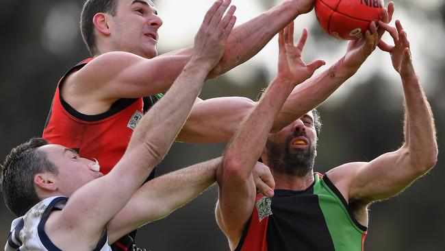 Brendan Mchugh, Sean Ragozzini and Nicholas Morrison-Storey fly for the ball  Picture: Andy Brownbill