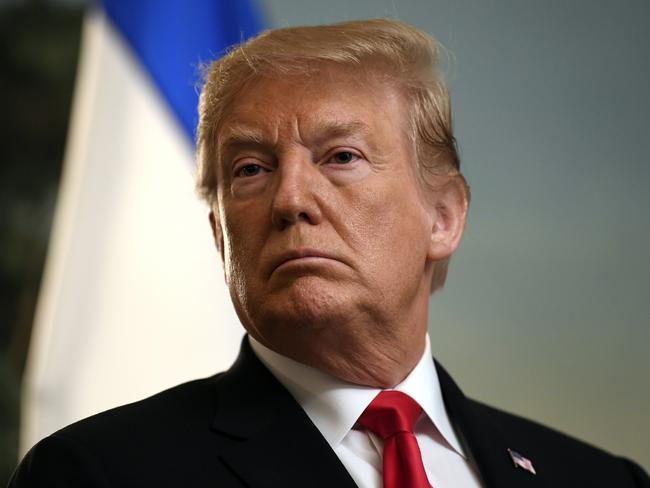 President Donald Trump listens in the Diplomatic Reception Room of the White House in Washington, Monday, March 25, 2019, as Israeli Prime Minister Benjamin Netanyahu speaks. Trump signed an official proclamation formally recognizing Israel's sovereignty over the Golan Heights. (AP Photo/Susan Walsh)