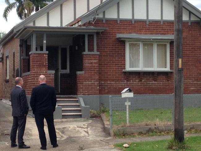 Detectives outside Monis’s girlfriend’s Belmore home before carrying out a search of the house today.