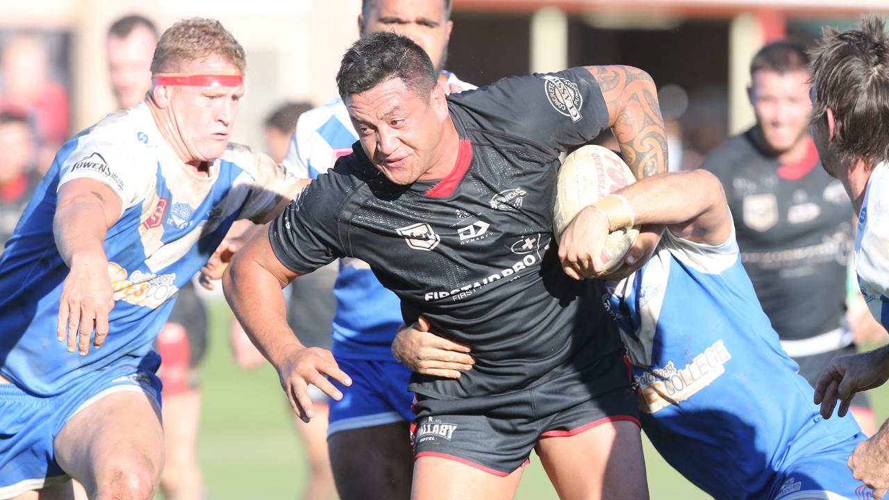 Jesse Malcolm charges through a tackle in a scrappy affair between Mudgeeraba and Tugun. Picture by Richard Gosling