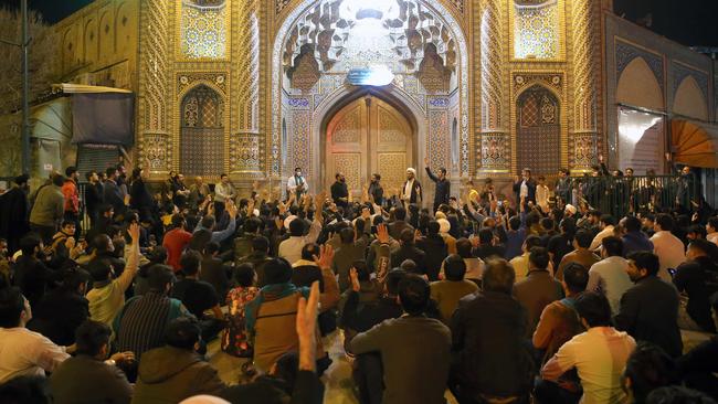 People gather outside the Fatima Masoumeh shrine in Qom. Picture: AFP