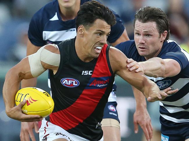 JLT Community Series. 07/03/2019. Geelong vs Essendon at GMHBA Stadium.   Essendon's Dylan Shiel breaks away from Geelong's Patrick Dangerfield  . Pic: Michael Klein