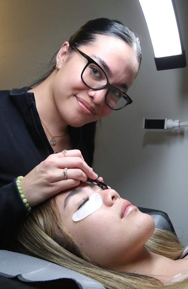 Eiffel Beauty owner Paris Hei has been named as a finalist for the best eyelash technician on the Gold Coast. Paris Hei with a client at her home base. Picture Glenn Hampson
