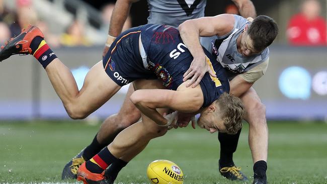 Robbie Gray tackles Hugh Greenwood early in Saturday’s game. Picture: Sarah Reed