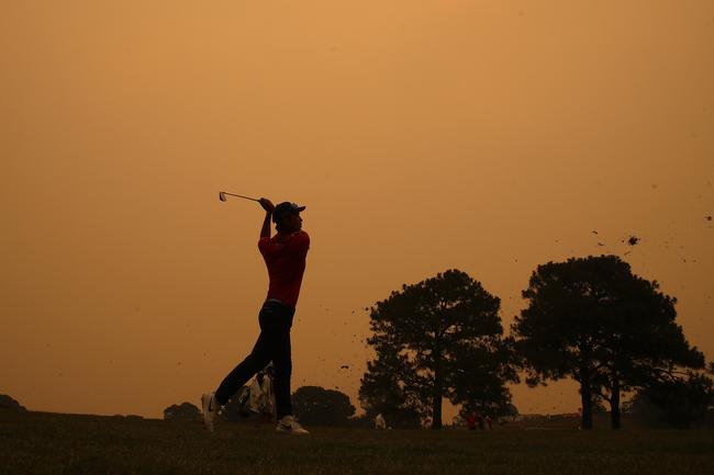 Min Woo Lee from WA hits to the 18th under a smokey haze during the first round of The Australian Open Golf Championships at The Australian Golf Club in Sydney. Picture: Phil Hillyard