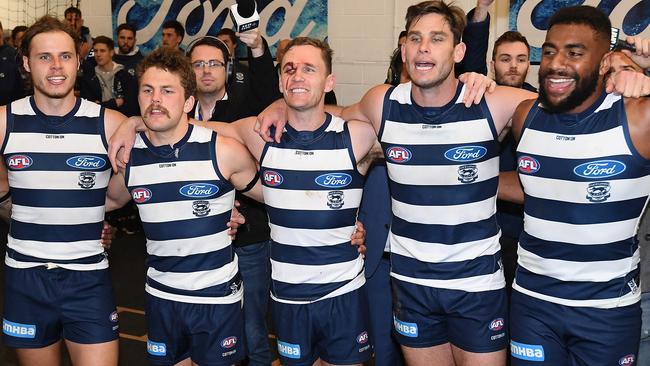 Jake Kolodjashnij, Tom Atkins, Joel Selwood, Tom Hawkins and Esava Ratugolea belt out the Cats song. Picture: Getty Images