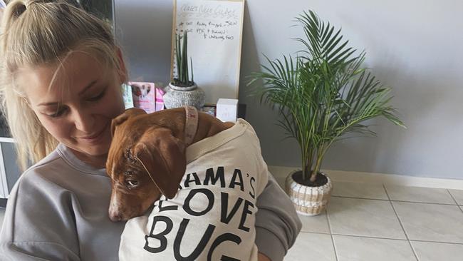 Bowen Collinsville Pet Rescue foster carer Nicole Rouse with dog Maddie, who she rescued after she was found in a cane field with broken leg and scratched face. Photo: Contributed