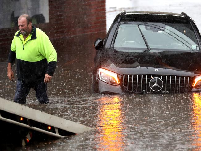 A car is stuck in flood waters on York St South Melbourne. Friday, January, 29. Picture: David Crosling