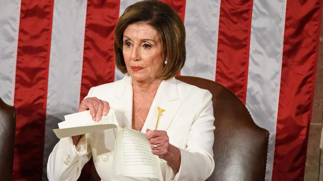 Speaker of the House Nancy Pelosi rips up a copy of US President Donald Trumps speech.