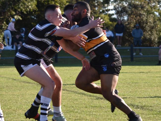 Harrison Marsh prepares to tackle Joseph Rokoqo. Picture: Sean Teuma/NewsLocal