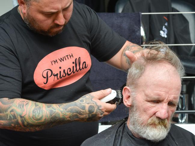 TAFE SA students providing free haircuts in Priscilla the TAFE van at the Hutt St Centre, Monday, November 20, 2017. Craig Gubbin gets a hair makeover from Matt Hill who is doing his Cert 3 in barbering at TAFE SA. (AAP Image/ Brenton Edwards)