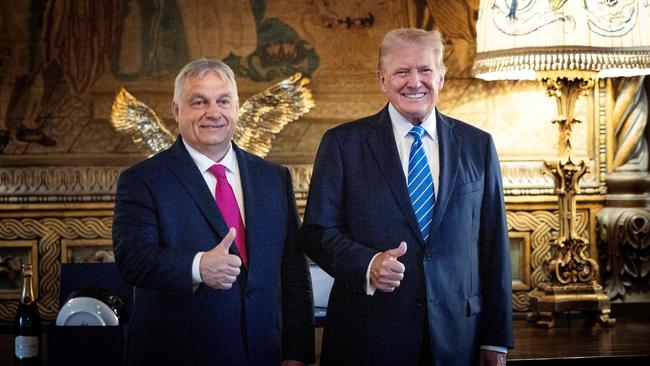 Hungary's Prime Minister Viktor Orban poses with former US president Donald Trump at Trump's estate in Mar-a-Lago. (Photo by ZOLTAN FISCHER / X ACCOUNT OF HUNGARY'S PRIME MINISTER VIKTOR ORBAN / AFP)